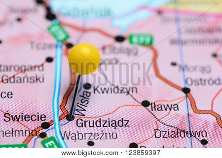 Photo of pinned Grudziadz on a map of Poland. May be used as illustration for traveling theme.