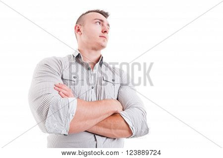 Hero shot in low angle of man or male model with arms crossed wearing shirt on white background