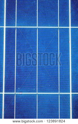 Close-up with blue solar panel cells as renewable energy concept