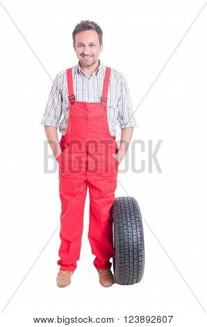 Friendly And Trustworthy Mechanic Standing With Hands In Pockets