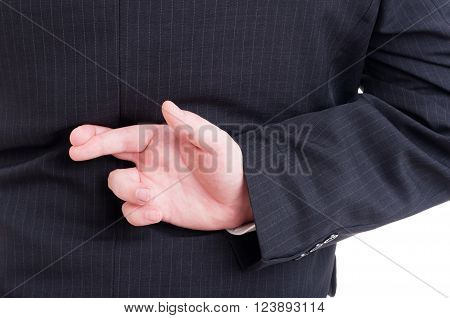 Accountant or financial manager making fingers crossed behind back as wishing metaphore gesture