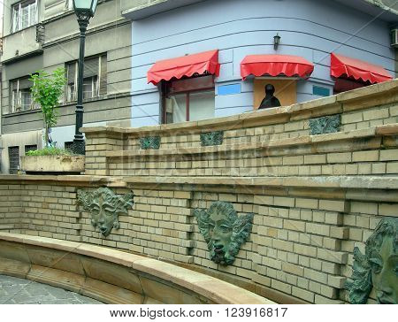 historic wall sculpture fountains in Bohemian section Skadarlija Belgrade, Serbia, Europe