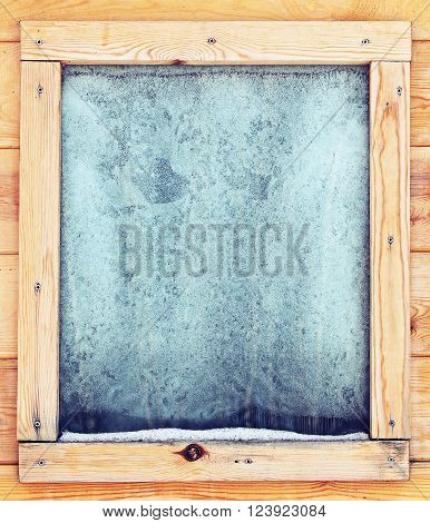 Icy window - in a wooden house