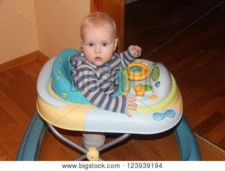 Toddler sitting in a walker