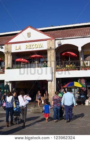 LA SERENA, CHILE - FEBRUARY 27, 2015: Unidentified people walking towards La Recova municipal market in the city center on February 27, 2015 in La Serena, Chile. La Recova houses mainly artisan shops and restaurants.