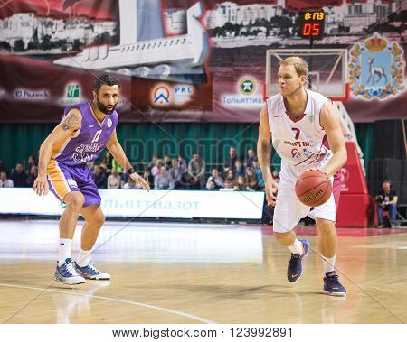 SAMARA RUSSIA - NOVEMBER 06, 2013: BC Krasnye Krylia guard Anton Ponkrashov (7) with ball is on the attack during the BC Royal Hali Gaziantep game on November 06 2013 in Samara Russia.
