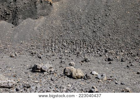 Arid view of some volcanic rocks on a hillside