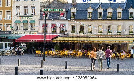 BOULOGNE-SUR-MER, FRANCE - JUNE 30, 2010: people in outdoor restaurants on square Place Dalton in summer evening. Boulogne is a coastal city in department of Pas-de-Calais of Northern France