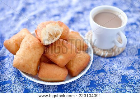 Fried Beignets with sugar, sweet and delicious New Orleans dessert.