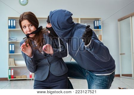 Criminal taking businesswoman as hostage in office