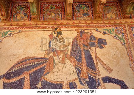 MANDAWA, RAJASTHAN, INDIA - DECEMBER 27, 2017: Details of the mural paintings at Goenka Double Haveli
