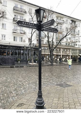 Odessa, Ukraine - December 28, 2017: People visit Deribasovskaya Street. Deribasovskaya is the central street of Odessa and one of the main attractions of the city.