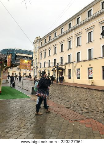 Odessa, Ukraine - December 28, 2017: People visit Deribasovskaya Street. Deribasovskaya is the central street of Odessa and one of the main attractions of the city.
