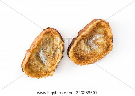 Traditional homemade Spanish torrijas isolated on white background. Easter dessert.