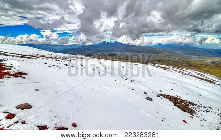 Distant view of the Ruminahui volcano from the slopes of the Cotopaxi, on an overcast day. Cotopaxi National Park, Ecuador.