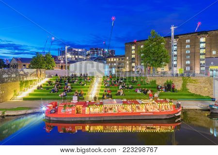 LONDON, UNITED KINGDOM - SEPTEMBER 23: This is a night view of Granry Square along the Regents Canal which is a popular location for students to relax on September 23, 2017 in London