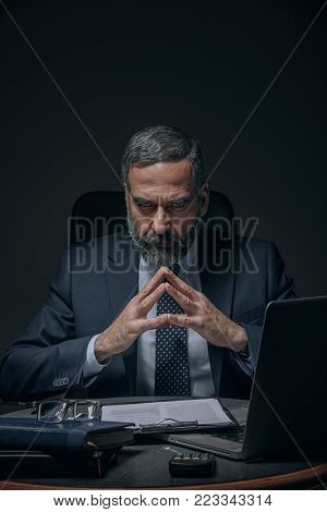 Senior boss, evil corporate overlord in the dark