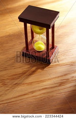 olf fashion sand hour glass on the wooden table