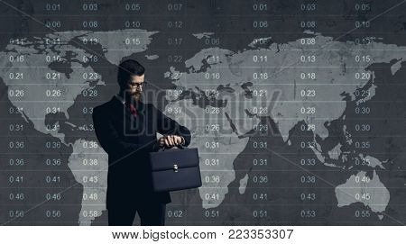 Businessman standing over diagram. World map background. Business, office, career concept.