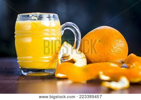 Close Up Of Orange,citrus Aurantium Juice On Wooden Surface.