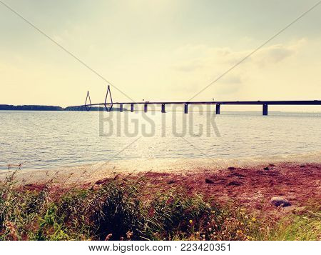 The famous Faro Bridge  in Denmark (Danish: Farobroerne). The two road bridge connect the islands of Falster and Zealand, view from Faro island.