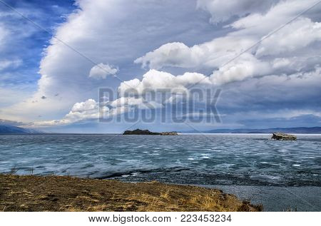 View above big beautiful lake Baikal with Ice floes floating on the water, Russia, Maloye sea