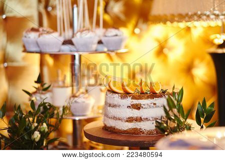 Candy bar. Table with sweets - cupcakes, candies, cakes, pies dessert. Wedding candybar.
