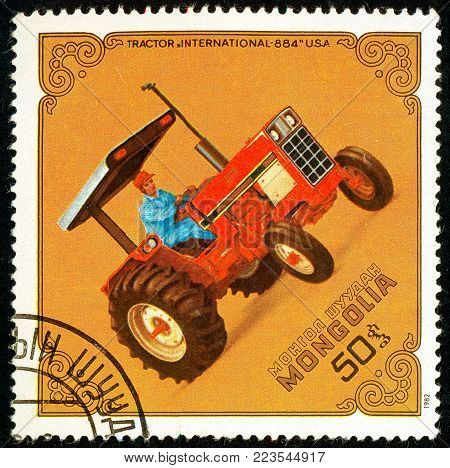 Ukraine - circa 2018: A postage stamp printed in Mongolia show Tractor Intl.-884, USA. Series: Tractors. Circa 1982