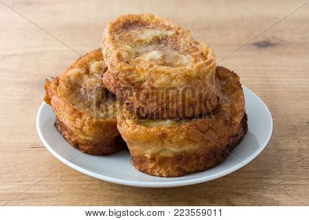 Traditional homemade Spanish torrijas isolated on white background. Easter dessert.