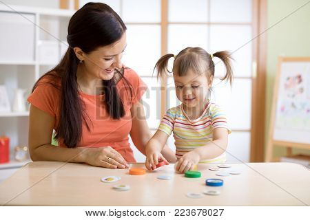 Mom with creative child daughter having fun time together