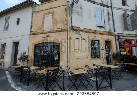 Arles, France - June 26, 2017: Cafe and restautants in the old town of Arles in Provence in the South of France.