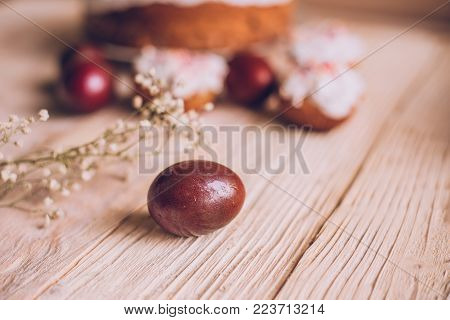 Easter Table With Traditional Easter Cakes And Easter Eggs With Blossoming Tree Branch