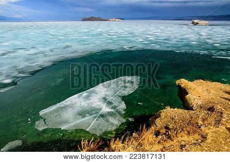 View above big beautiful lake Baikal with Ice floes floating on the water, Russia, Maloye sea