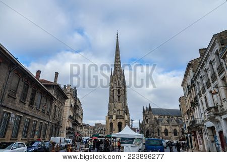 BORDEAUX, FRANCE - DECEMBER 24, 2017: St Michel Basilica (Basilique Saint Michel) with its iconic tower in the city center of Bordeaux. This gothic chuch is one of most visible landmarks of the city