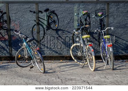 Three bicycles mirrored in the black windows of the university library in Freiburg im Breisgau. Which is a german town nearby Switzerland and France.