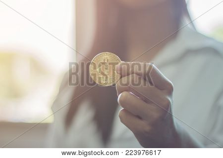 han hold bitcoin future money in woman hand.for future and new money era.