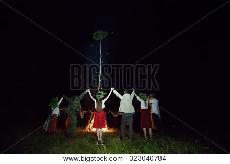 Belarus, The City Of Gomel, July 08, 2018. Holiday Ivan Kupala. People Dance Around The Campfire. Ku