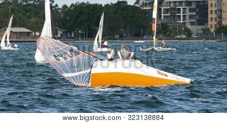 Lake Macquarie, Australia - April 16, 2013: Capsized Competitors Competing In The Australian High Sc