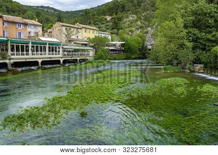 South Of France, View On Small Provencal Town Of Poet Petrarch Fontaine-de-vaucluse With Emerald Gre