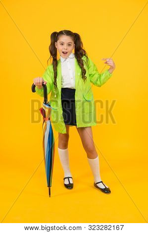 She A Fashion Victim. Cute Schoolchild Pointing Finger With Fashion Look On Yellow Background. Littl