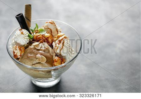 Caramel And Almond Ice Cream With Caramelized Popcorn Sundae Dessert In Glass Bowl