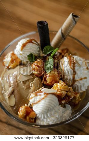 Caramel And Almond Ice Cream With Caramelized Popcorn Sundae Dessert In Glass Bowl