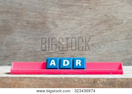 Tile Letter On Red Rack In Word Adr (abbreviation Of Adverse Drug Reaction) On Wood Background