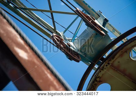 Steel Cable And Winch. Part Of An Old Winch With A Steel Rope On A Lift. Detail Of The Cableway. Clo