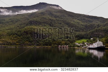 View Across The Fjord Water At Flam With The Tourist Boat.