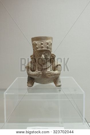 Caceres, Spain - March 28th, 2019: Jama Coaque Culture Seated Figurine, Pre-hispanic Ecuadorian Peop