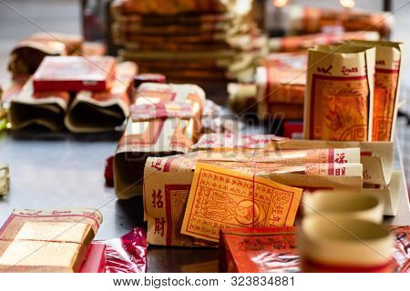 Yunlin, Taiwan - July 13th, 2019: chinese joss gold paper craft on a table at Beigang Chaotian Temple, Yunlin, Taiwan, Asia