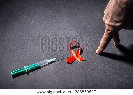 Injecting Drug Use Leads To Hiv Infection. Concept Step To Drugs. A Hand Steps Fingers To A Syringe 