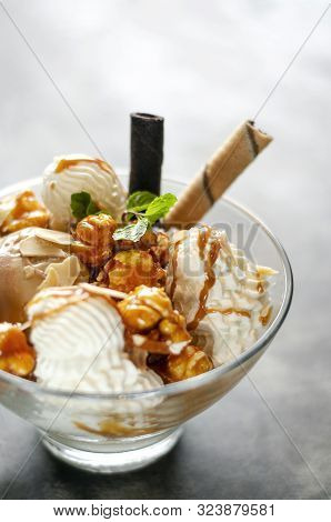 Caramel And Almond Ice Cream With Caramelized Popcorn Sundae Dessert In Glass Bowl