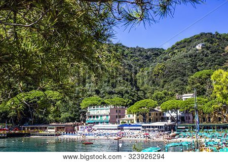 The Sand Beach Known As Paraggi Near Portofino In Genoa On A Blue Sky And Sea Background